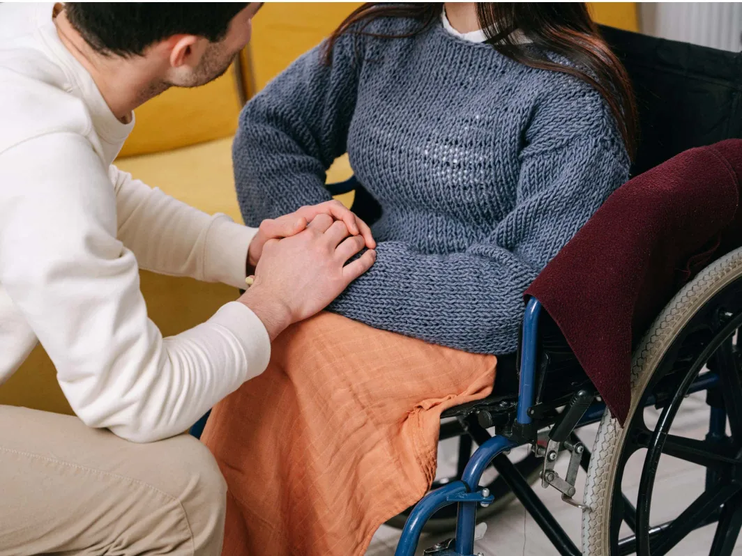 Showing support to a patient with cerebral palsy