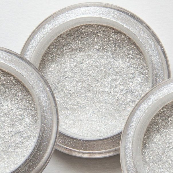 three pots of white and silver glitter asbestos powder